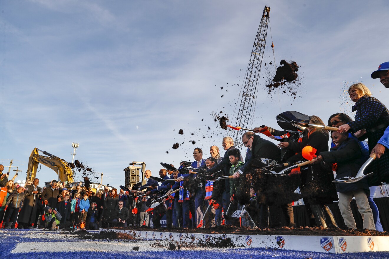 Project leaders, local politicians and members of the community participate in a formal groundbreaking ceremony on the new stadium in the West End for FC Cincinnati, Tuesday, Dec. 18, 2018.